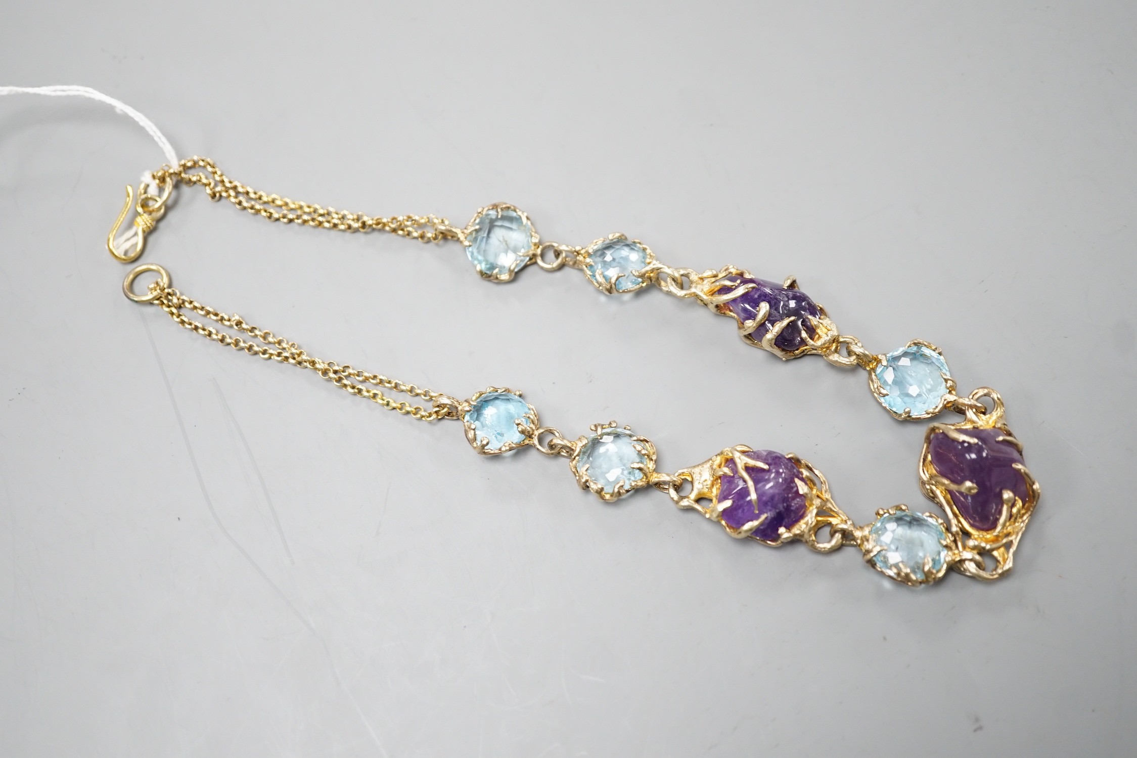 A gilt 925 amethyst pebble and gem set necklace, 42cm.